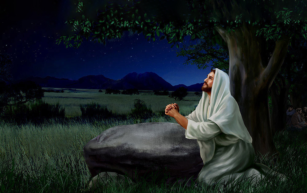 Hình ảnh Chúa Giêsu đang cầu nguyện trên một tảng đá